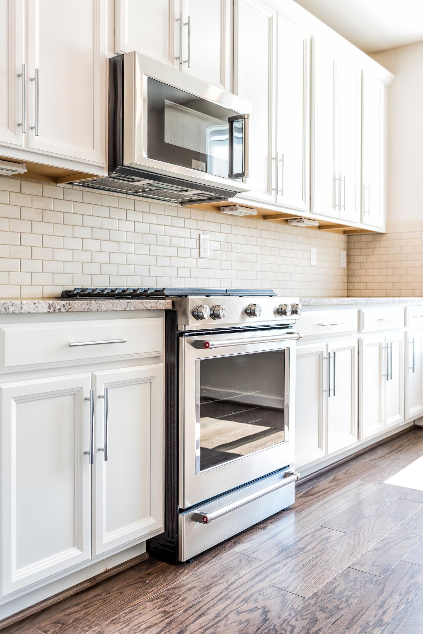 Stylish kitchen cabinets in Brookhaven, PA, showcasing white cabinetry and a stainless steel oven fr