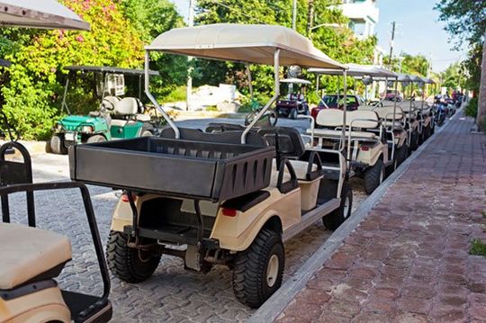 Golf carts in a row