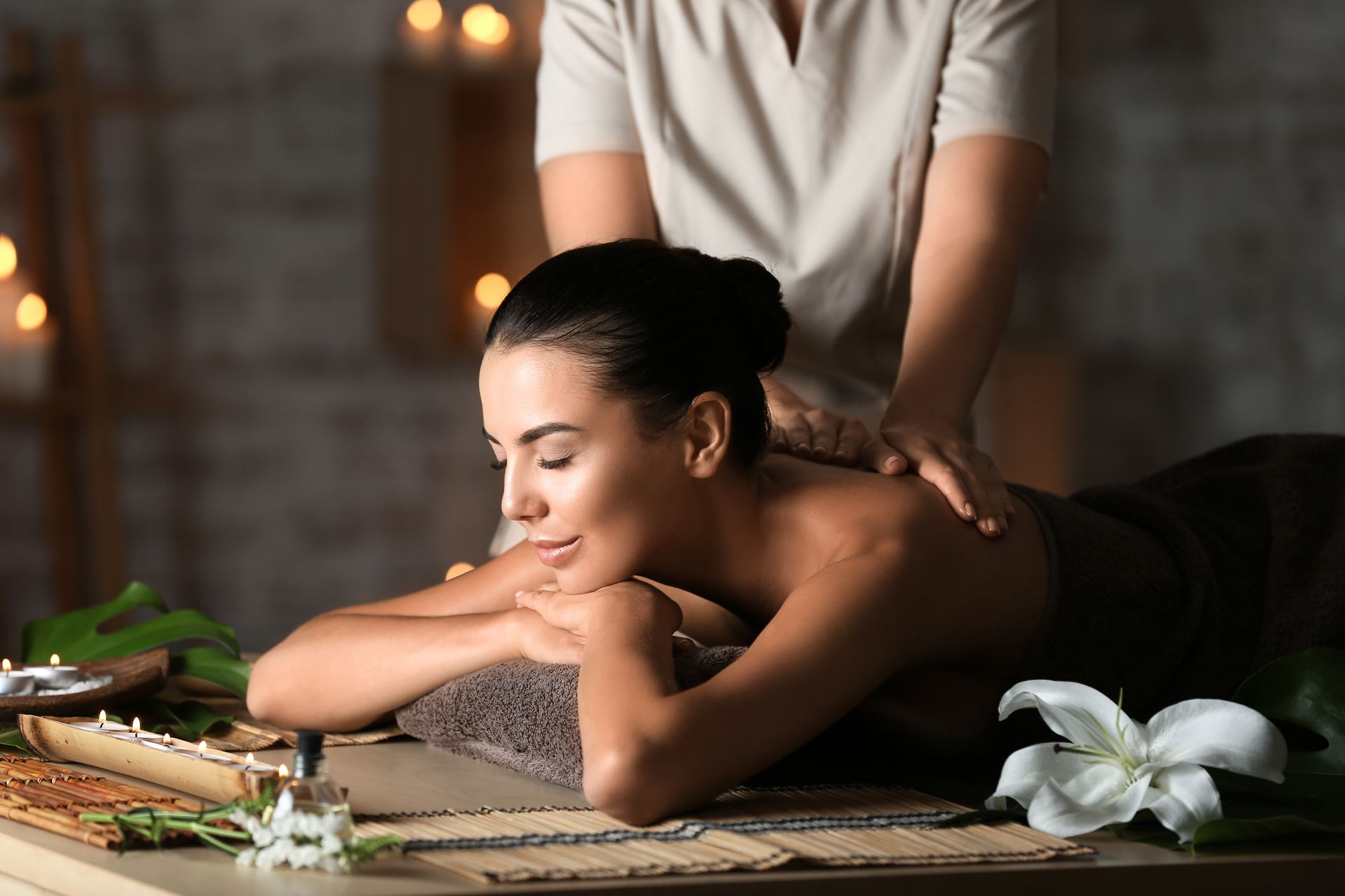 A woman is getting a massage in a spa.