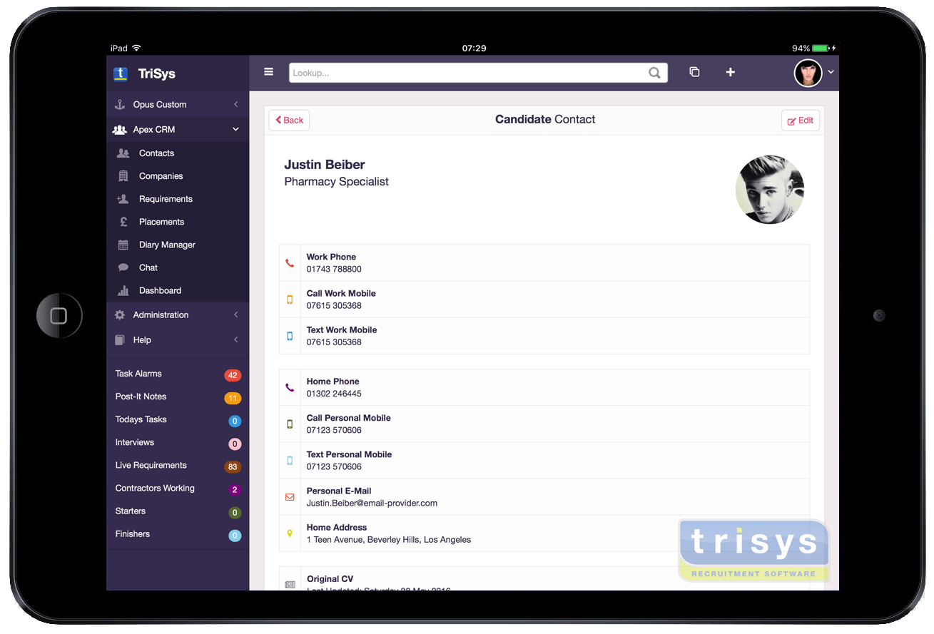 A tablet with a purple screen and a picture of a man on it.