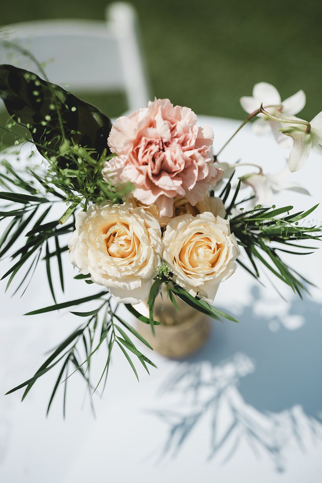 A Vase Filled With Flowers Is Sitting On A Table - Honolulu, HI - Bella Rosa Corporation
