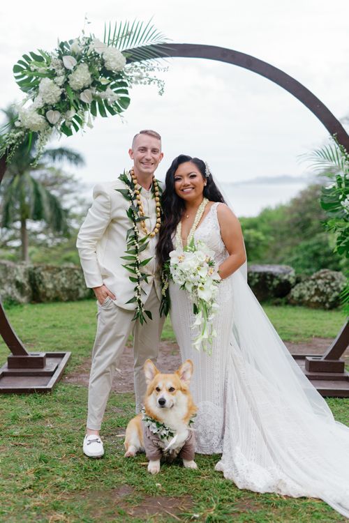 A Bride And Groom Are Posing For A Picture With Their Dog - Honolulu, HI - Bella Rosa Corporation