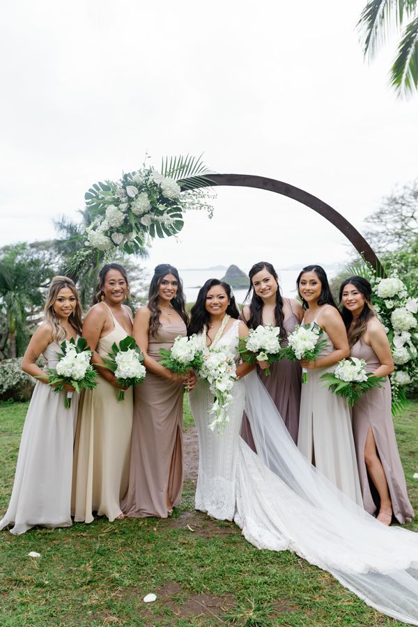 A Bride And Her Bridesmaids Are Posing For A Picture - Honolulu, HI - Bella Rosa Corporation