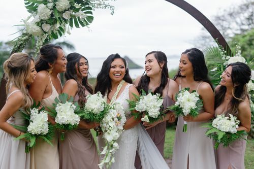 A Bride And Her Bridesmaids Are Posing For A Picture - Honolulu, HI - Bella Rosa Corporation