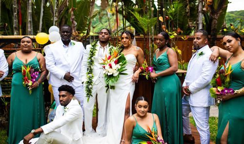 The Bride And Groom Are Posing For A Picture With Their Wedding Party - Honolulu, HI - Bella Rosa Corporation