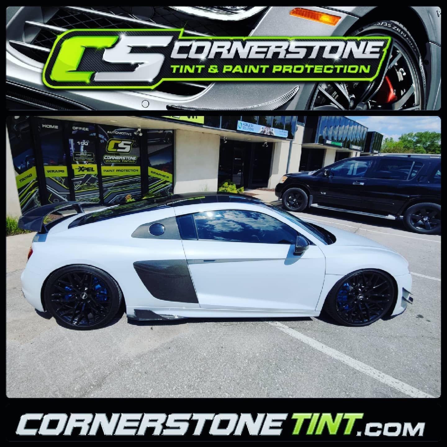 A white sports car is parked in front of cornerstone tint and paint protection