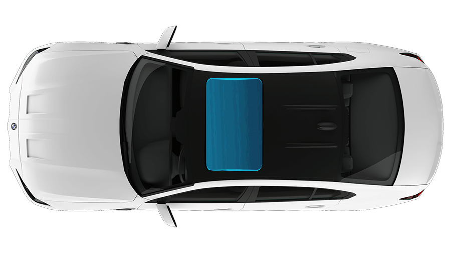 An aerial view of a white car with a blue windshield.