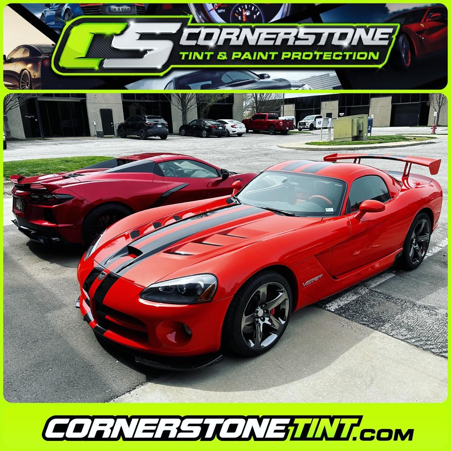 Two red sports cars are parked next to each other in front of cornerstone tint and paint protection
