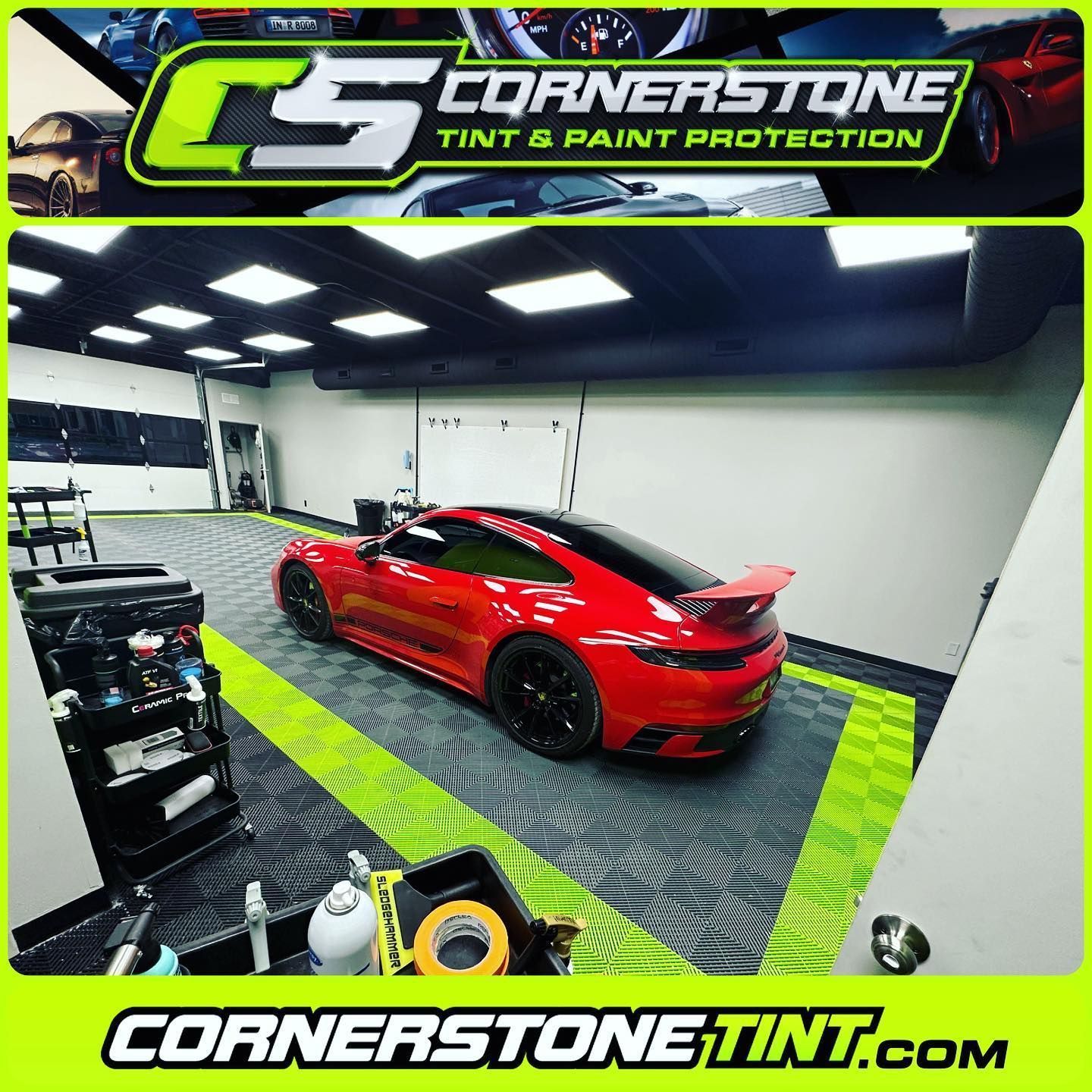 A red sports car is parked in a garage.