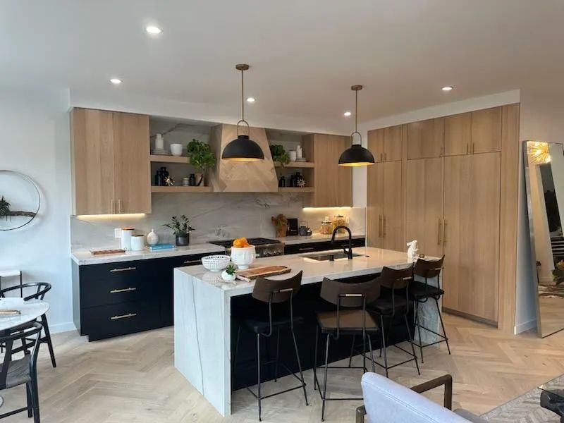 A kitchen with a large island in the middle of the room.
