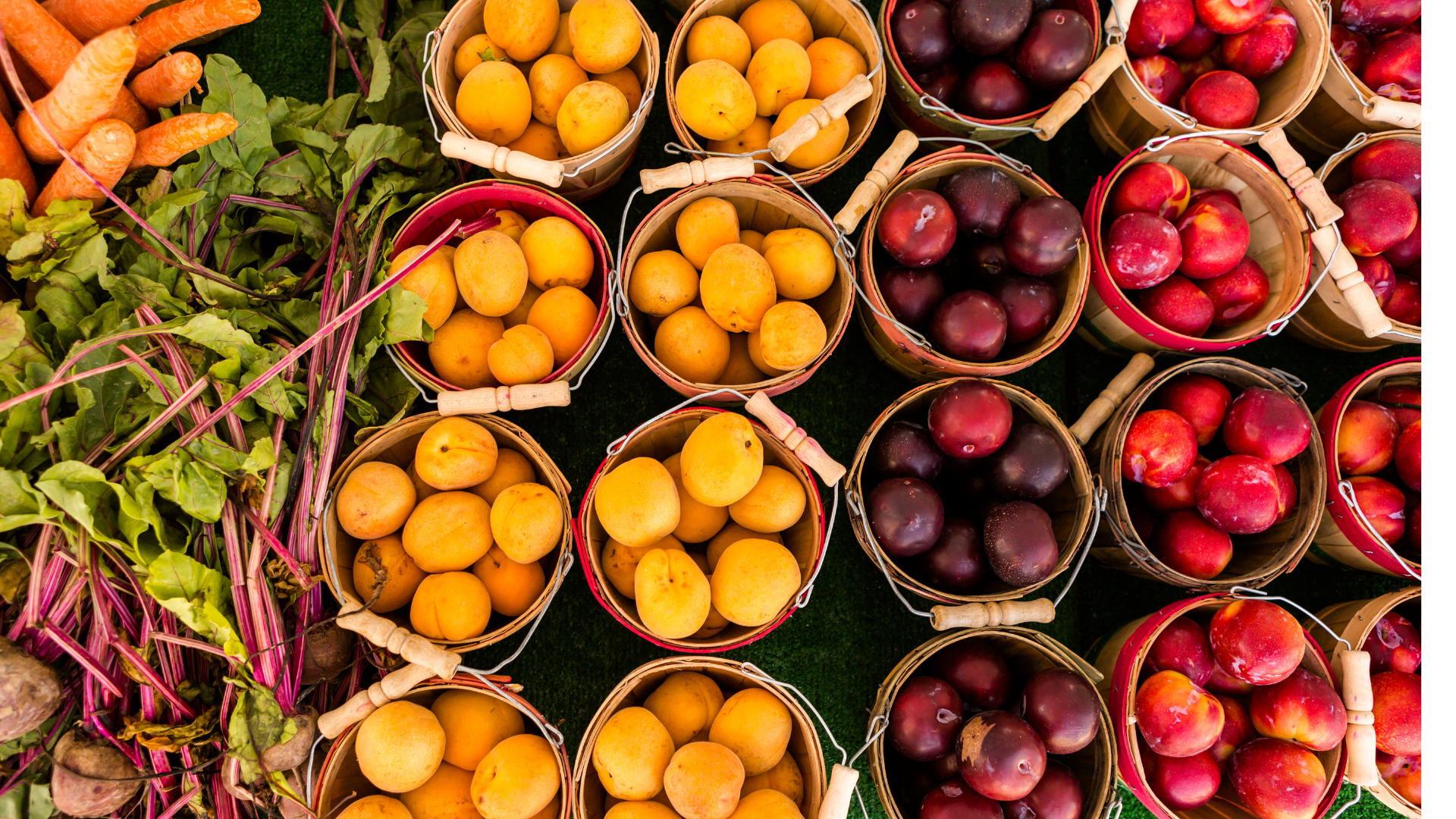 There are many different types of fruits and vegetables in the baskets.