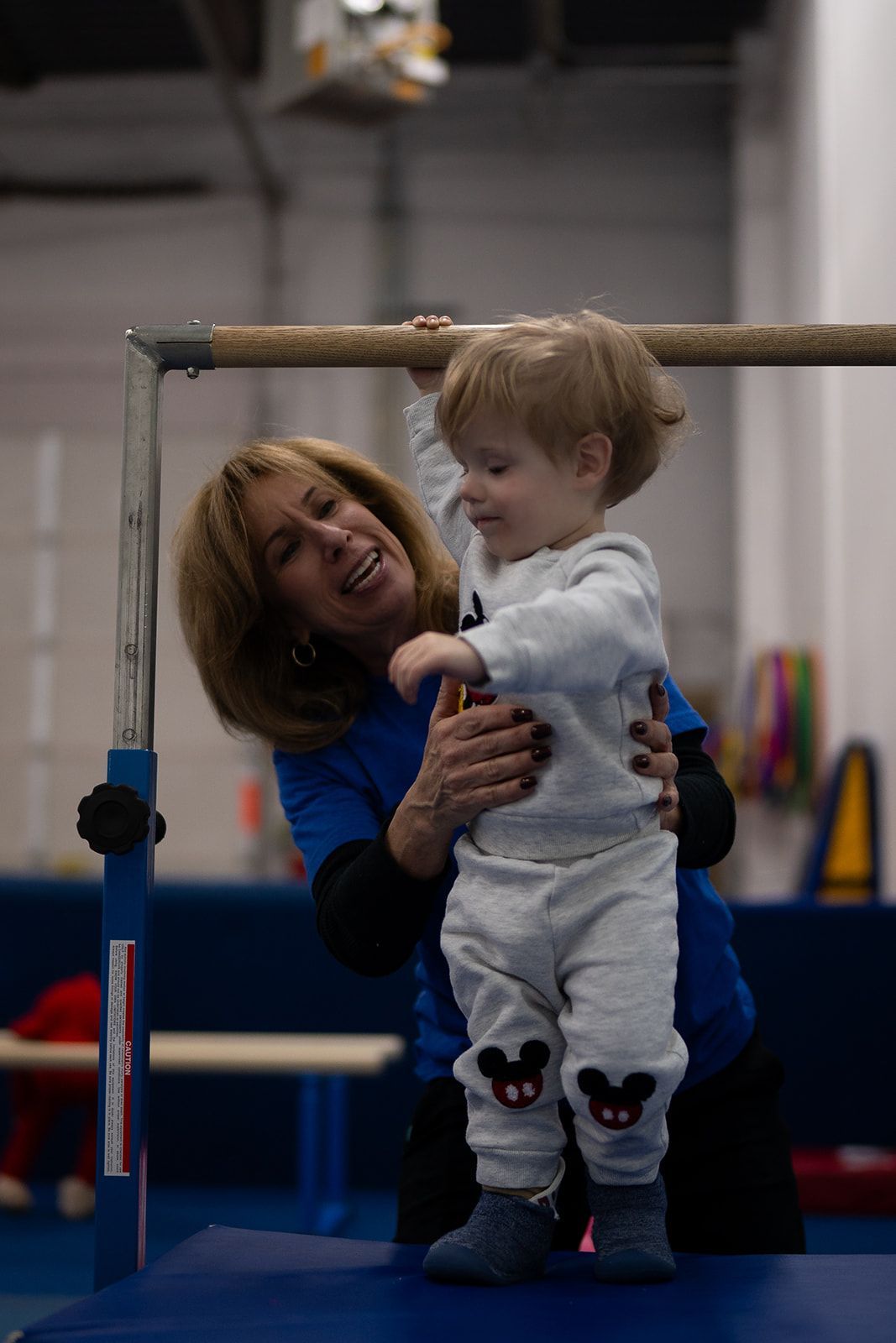 A child with special needs is being helped by Developmental Pathways trained staff to exercise