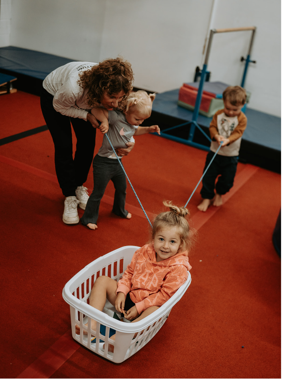 A child with special needs is being helped by Developmental Pathways trained staff to exercise