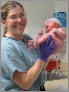 Medical Staff Holding A Baby – Libby, MO – Northwest Community Health