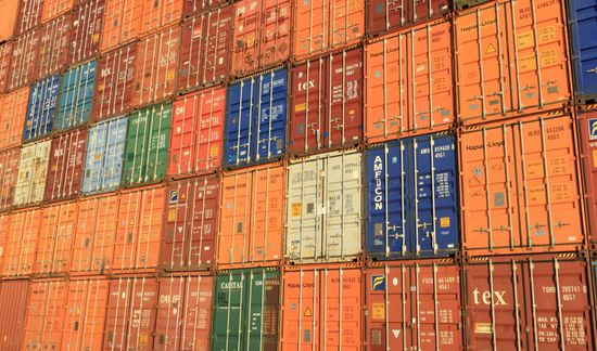 A bunch of shipping containers with one that says tex on it