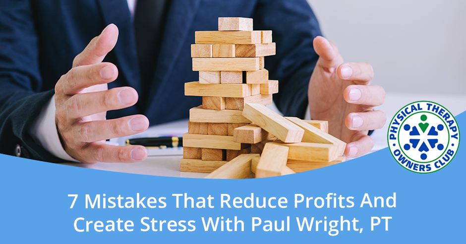 A man in a suit is holding a stack of wooden blocks.