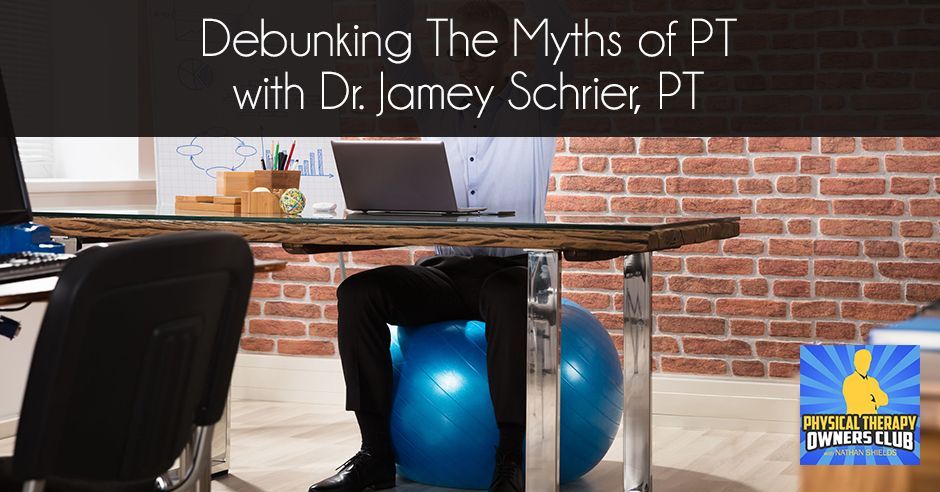 A man sits on an exercise ball under a desk with a laptop