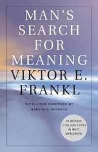 A book titled man 's search for meaning by viktor e. frankl