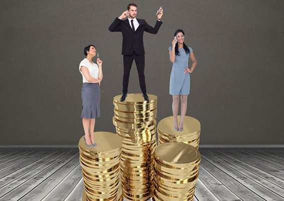 A man and two women are standing on stacks of gold coins.