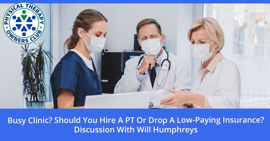 A group of doctors and nurses wearing face masks are looking at a laptop.