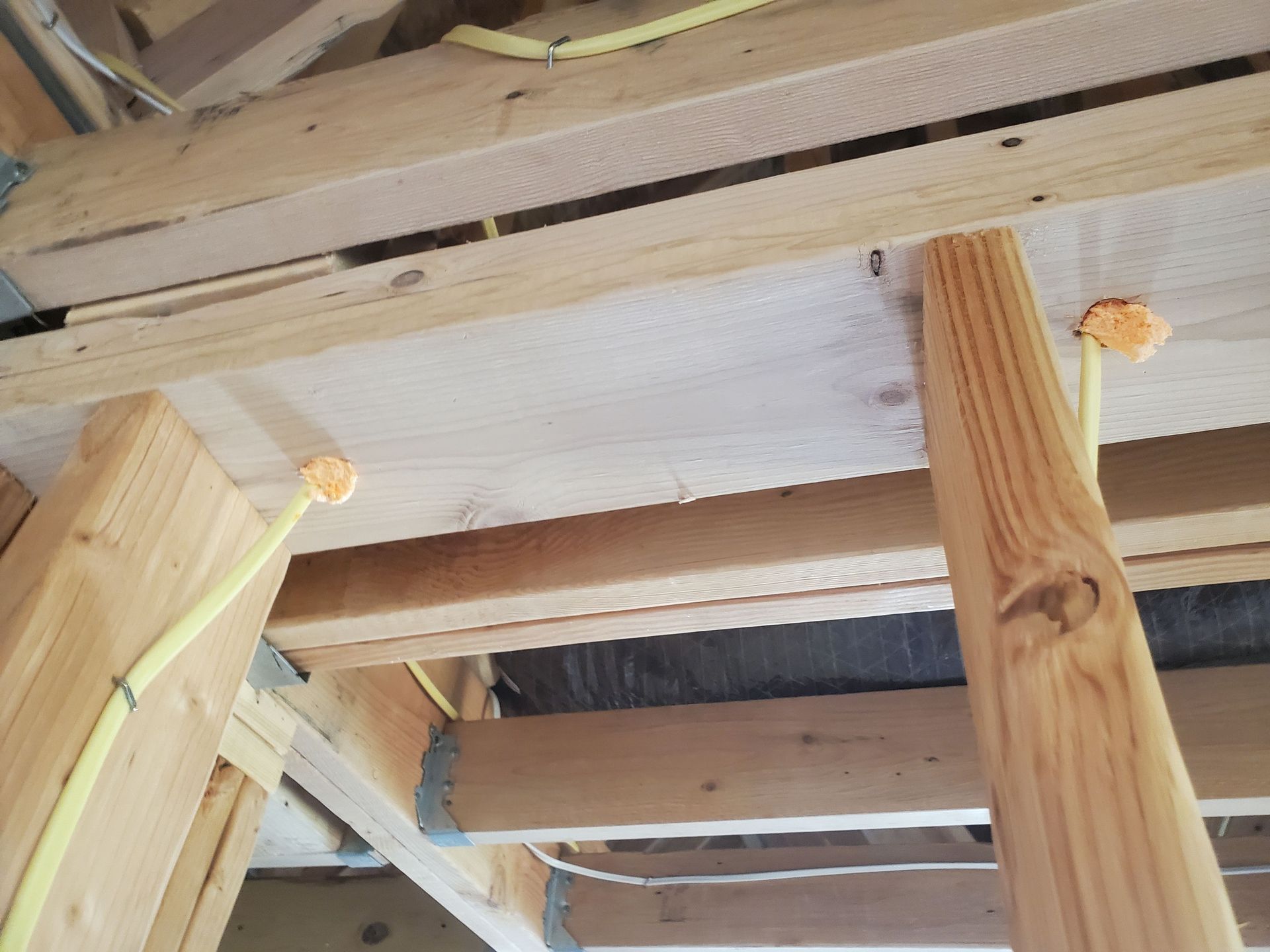 A wooden structure with electrical wires coming out of it