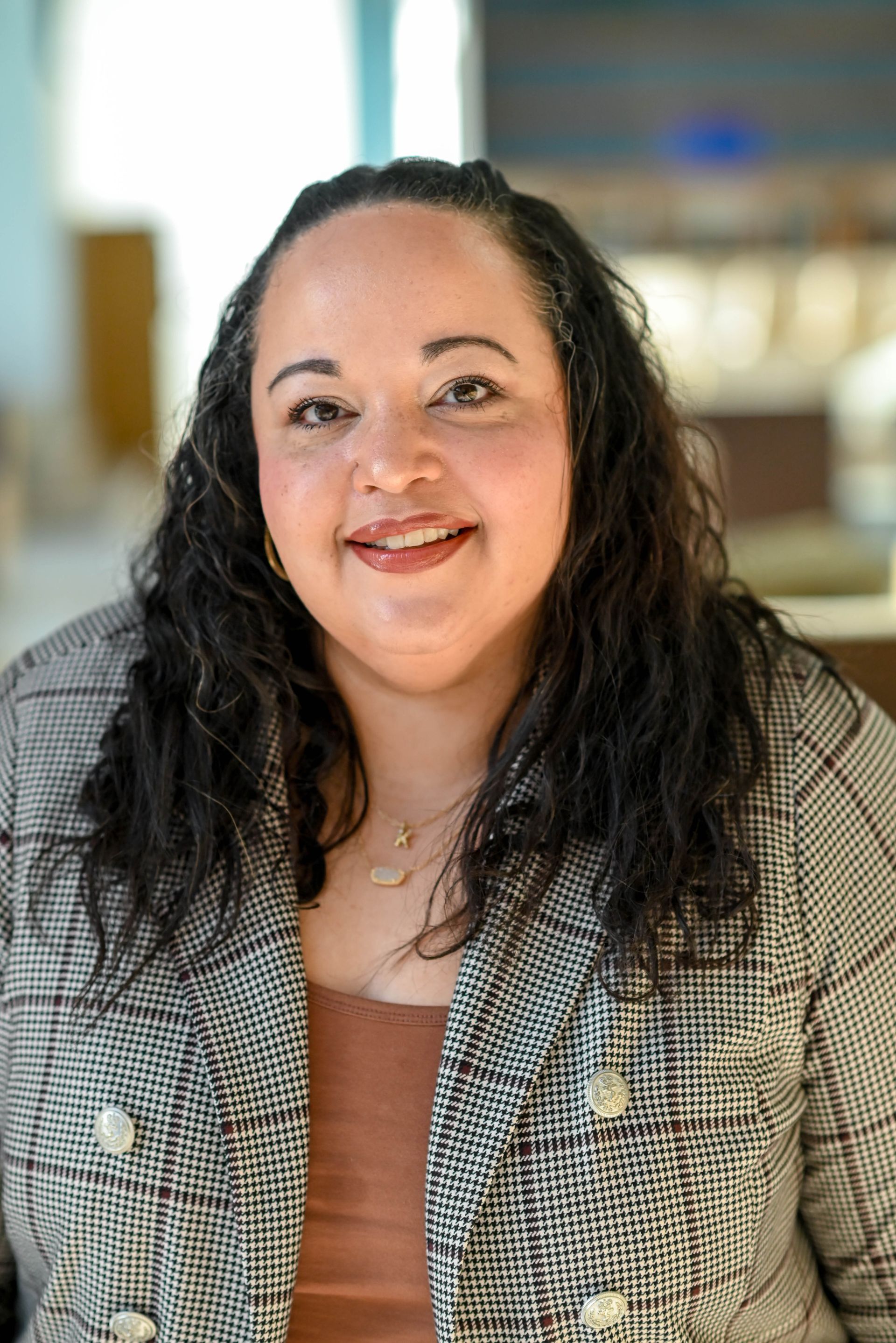 A man in a suit is standing with his hands in his pockets