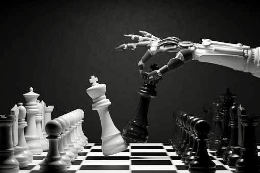 A robotic arm is playing a game of chess.