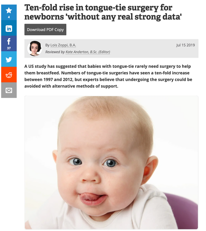 a baby 's tongue is sticking out in a news article 