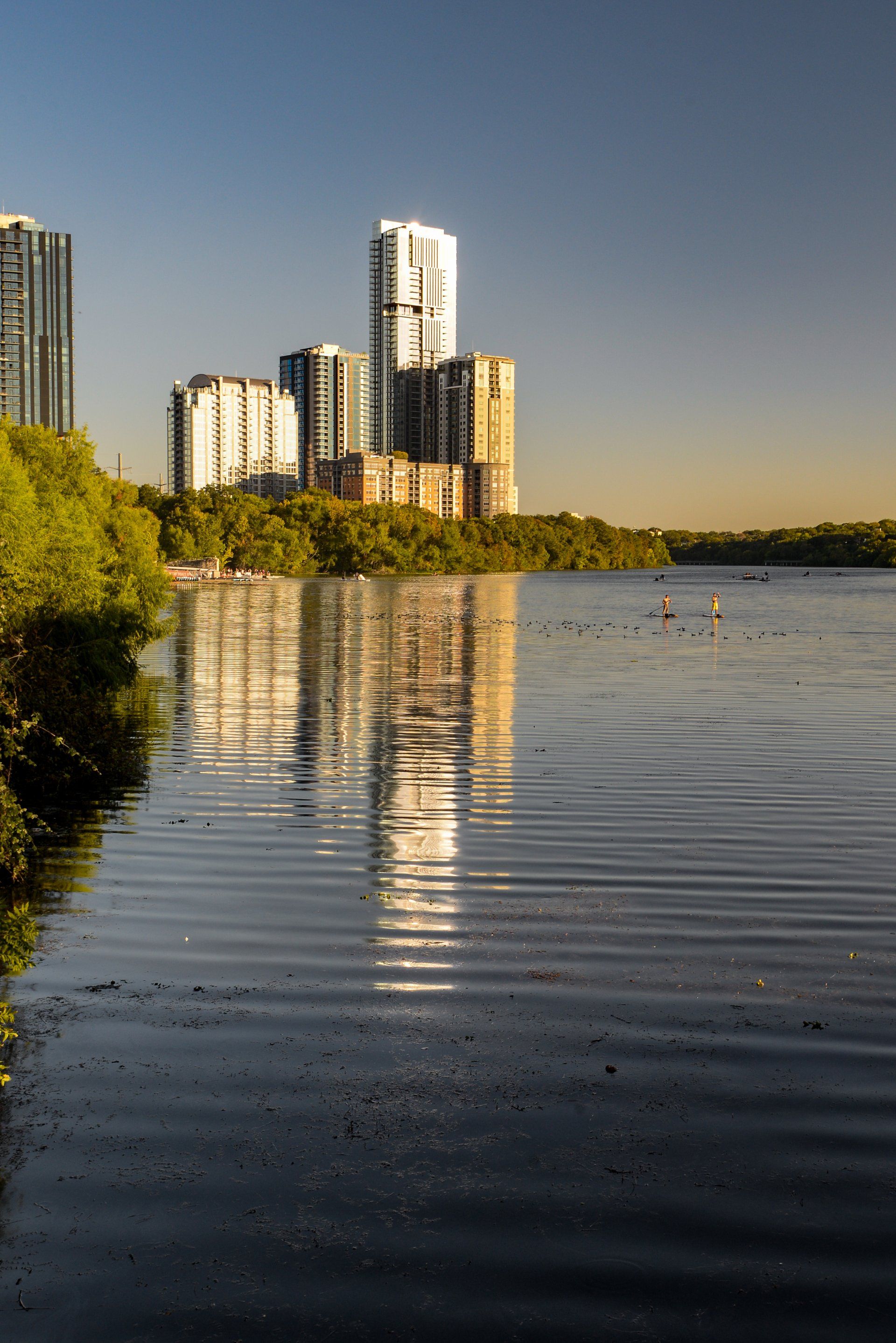 A large body of water with a city in the background