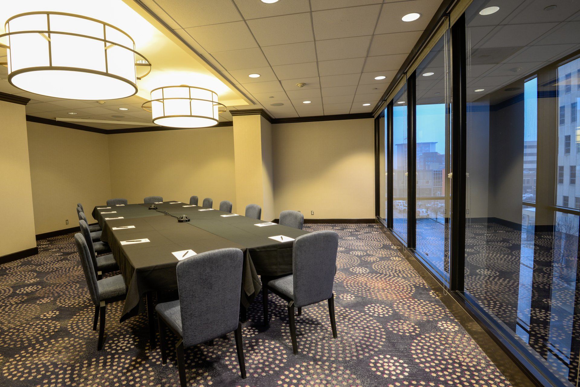 A conference room with a long table and chairs