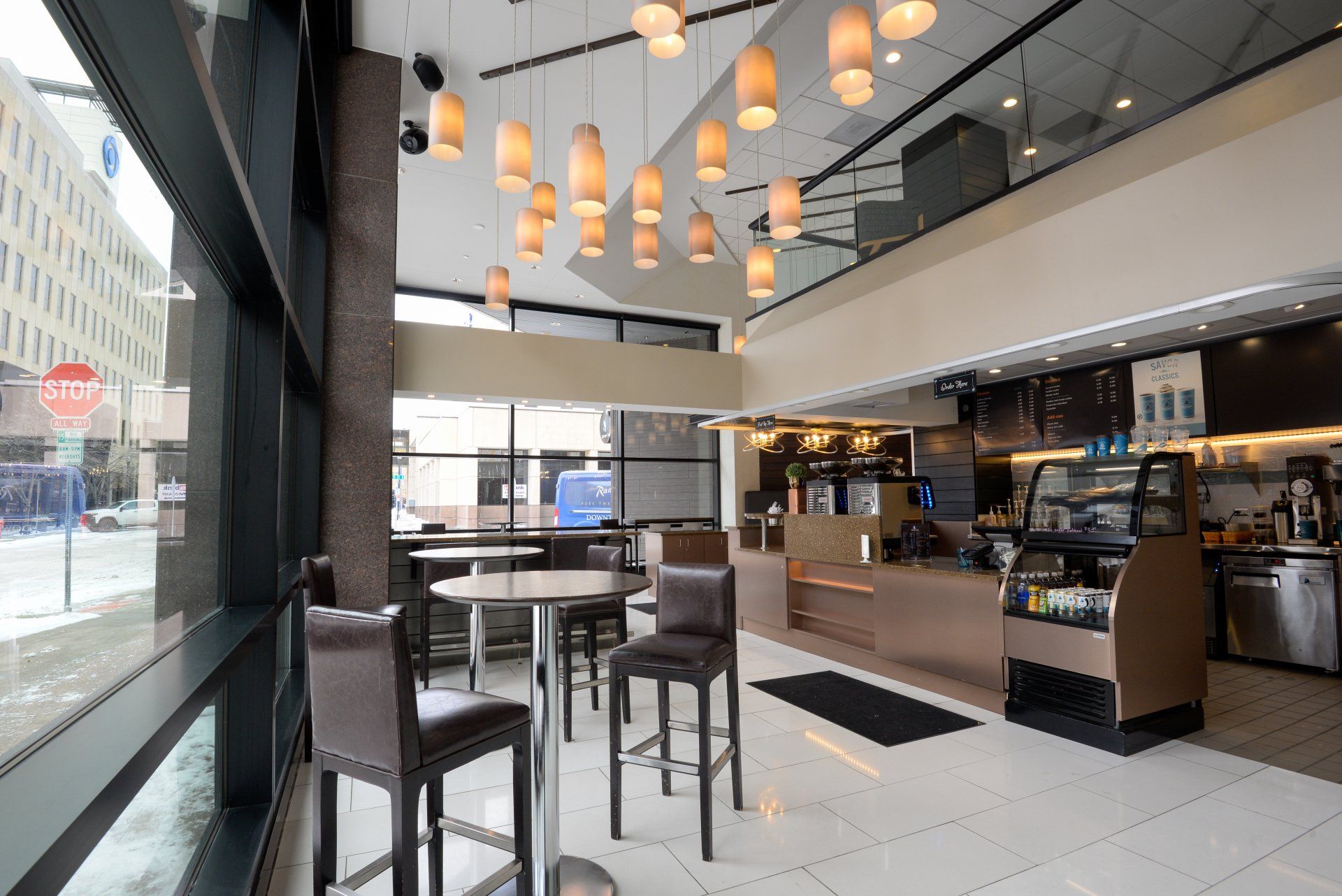 The inside of a restaurant with tables and chairs