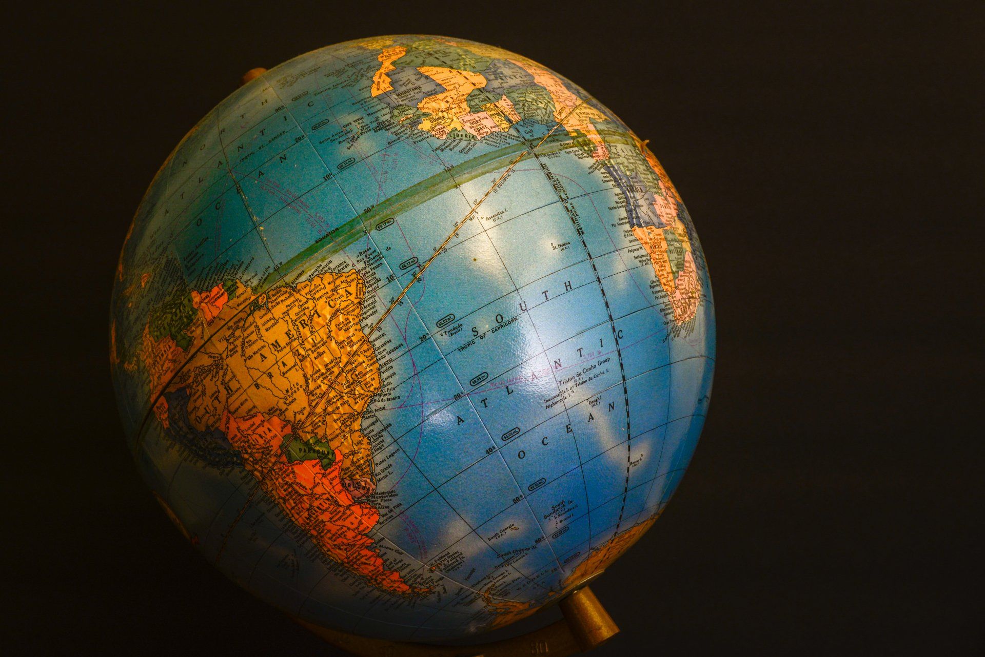 A blue and orange globe with a black background