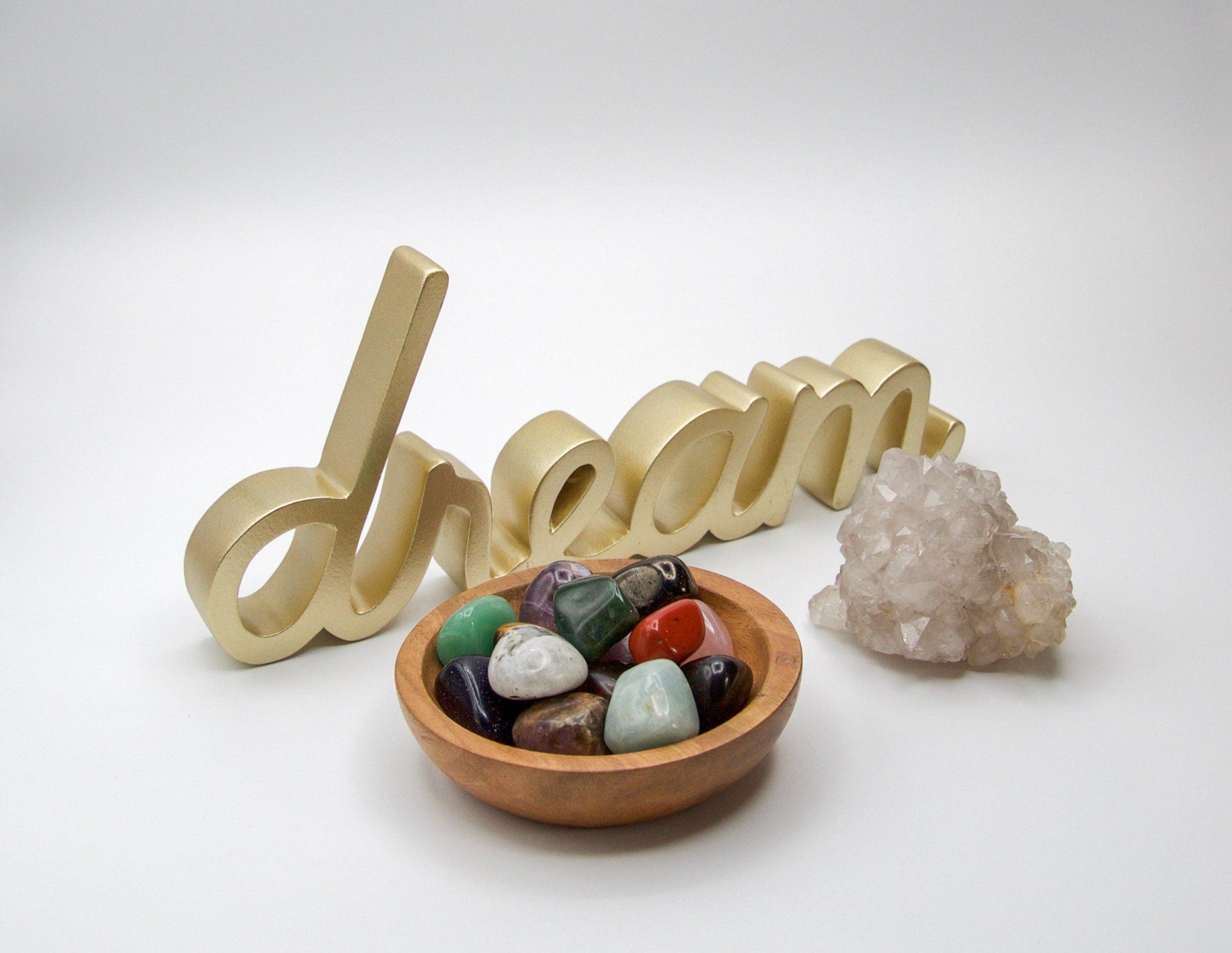 A bowl of rocks sits next to the word dream
