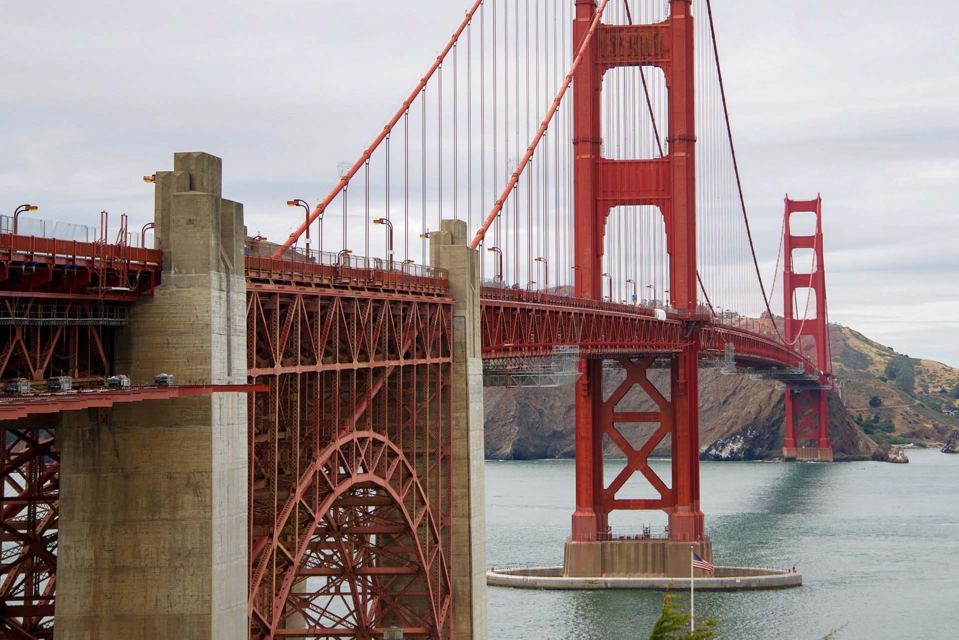 A large red bridge over a body of water