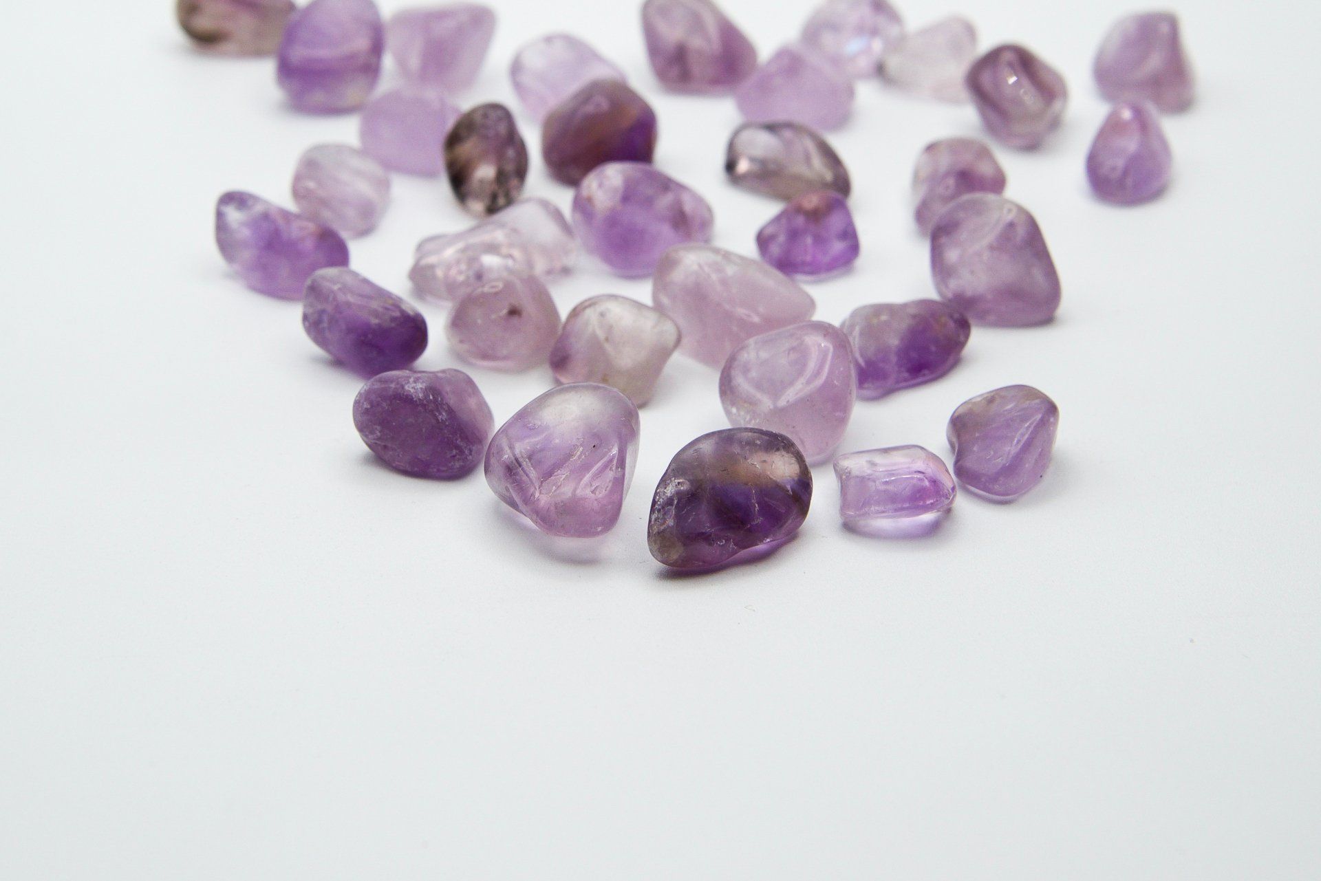 A pile of purple rocks on a white surface