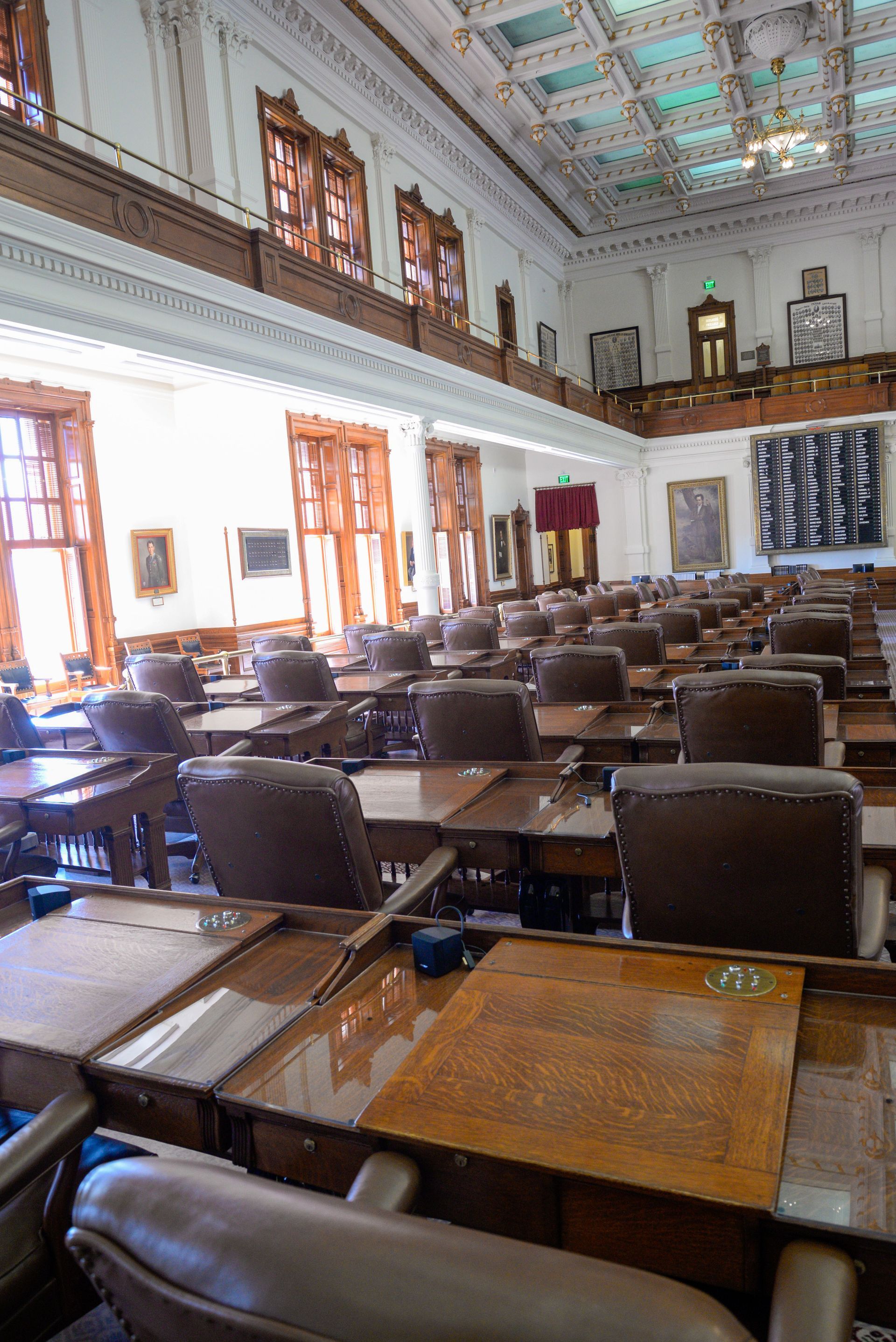 A large room with lots of tables and chairs