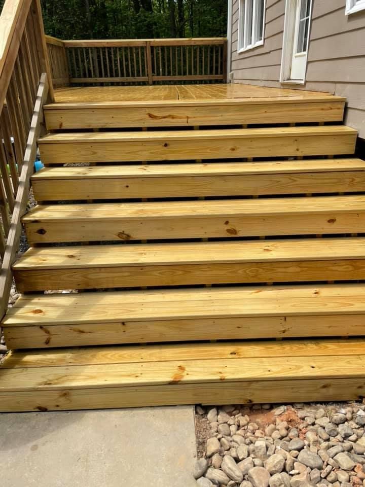 A wooden deck with stairs leading up to it.