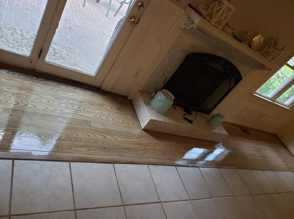 A living room with a fireplace and a sliding glass door.