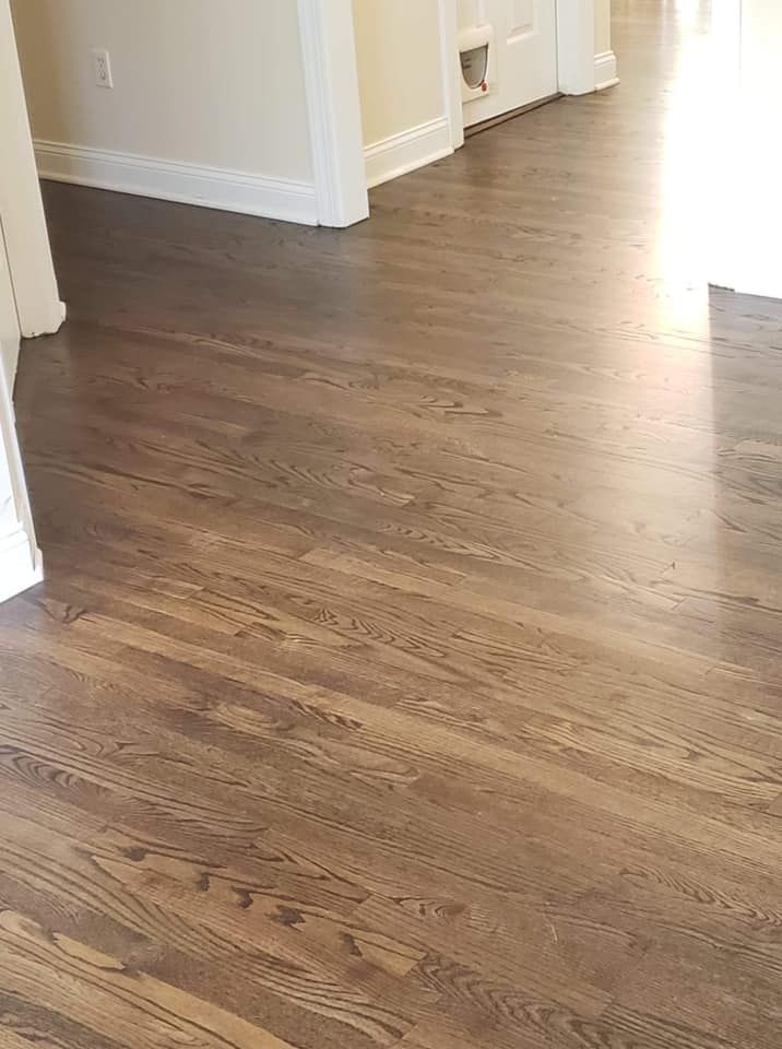 A close up of a wooden floor in a room.
