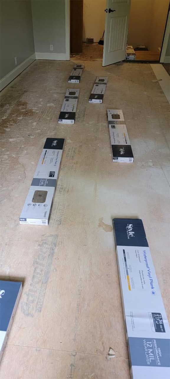 A room with a lot of boxes on the floor.