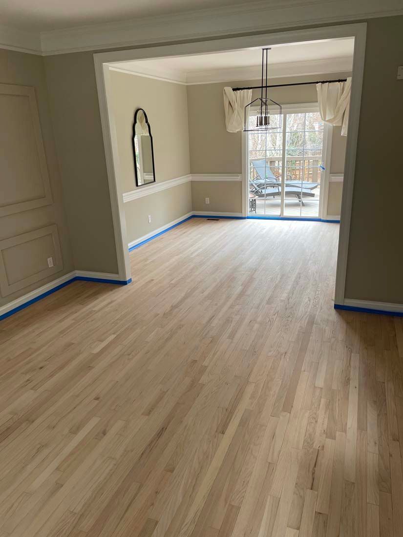 parquet floor - store salesman with flooring samples in hands.