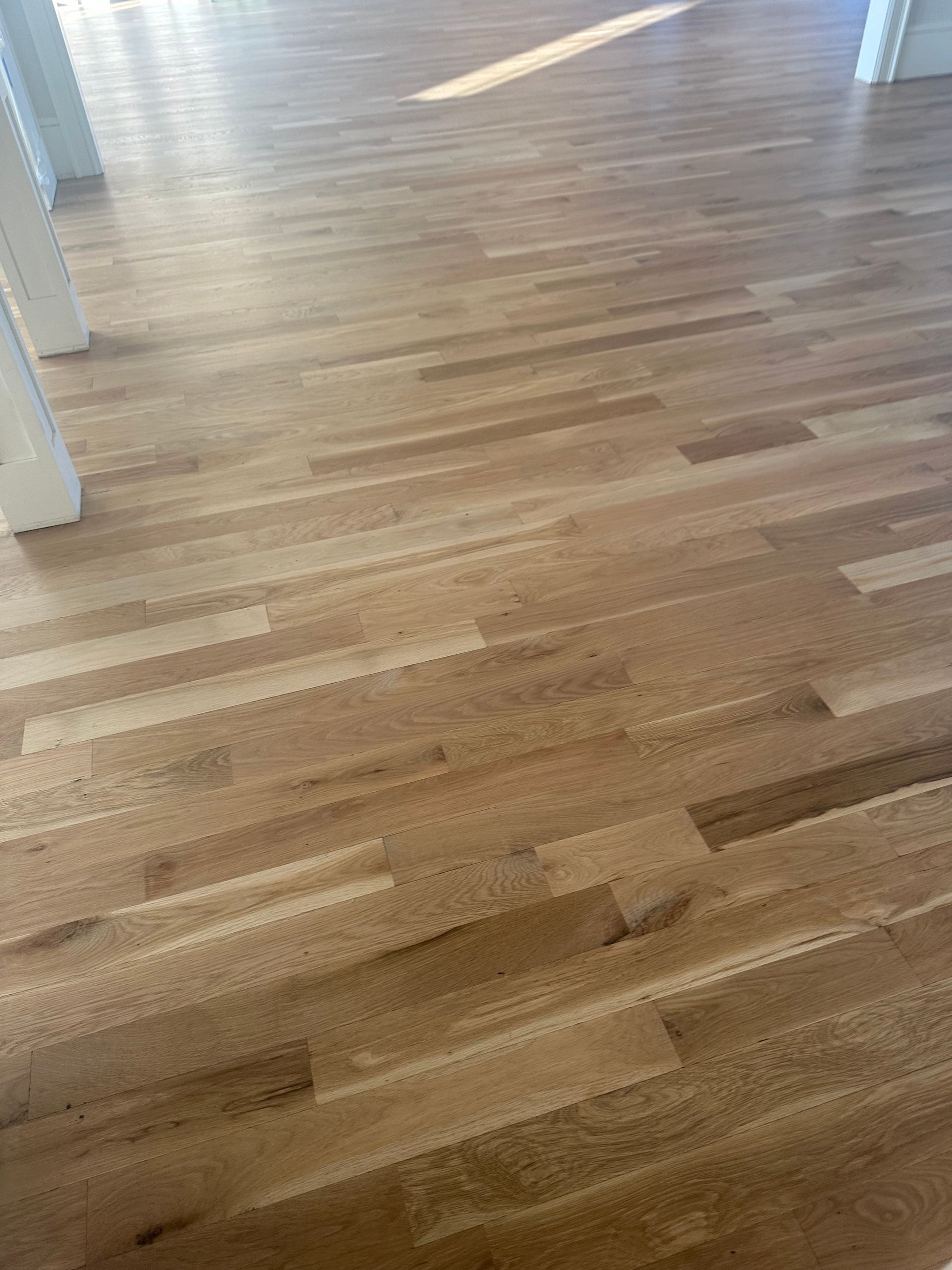 A close up of a wooden floor in a room.