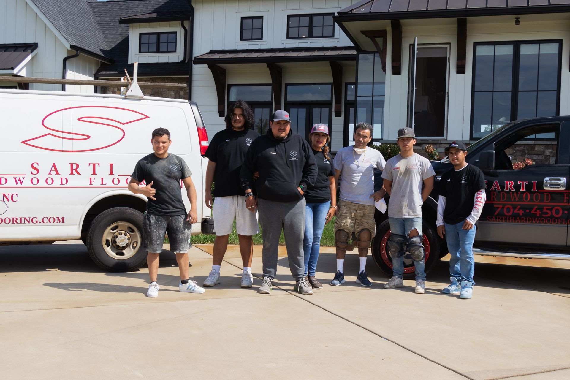 parquet floor - store salesman with flooring samples in hands.