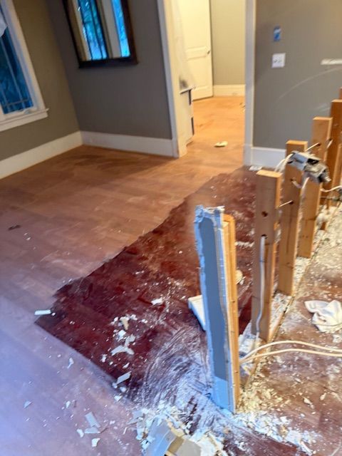 A room with a lot of pieces of wood on the floor