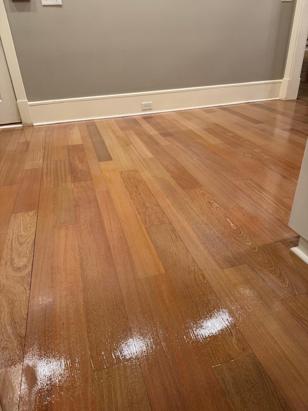 A close up of a wooden floor in a room.