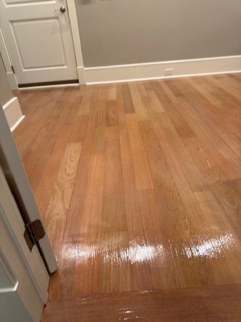 A room with a wooden floor and a door