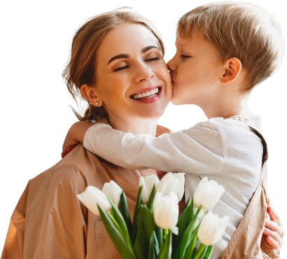 A little boy is kissing his mother on the cheek while holding a bouquet of flowers.