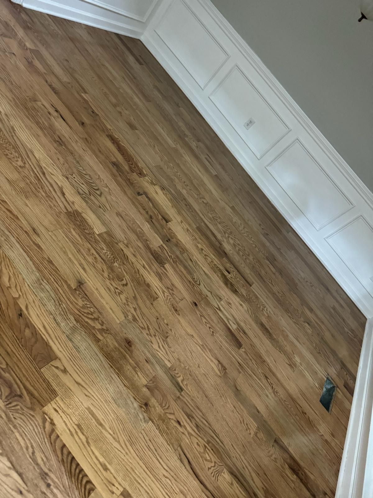 A room with hardwood floors and white trim.