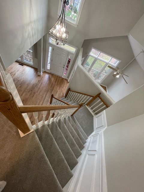 An aerial view of a staircase leading up to the second floor of a house.