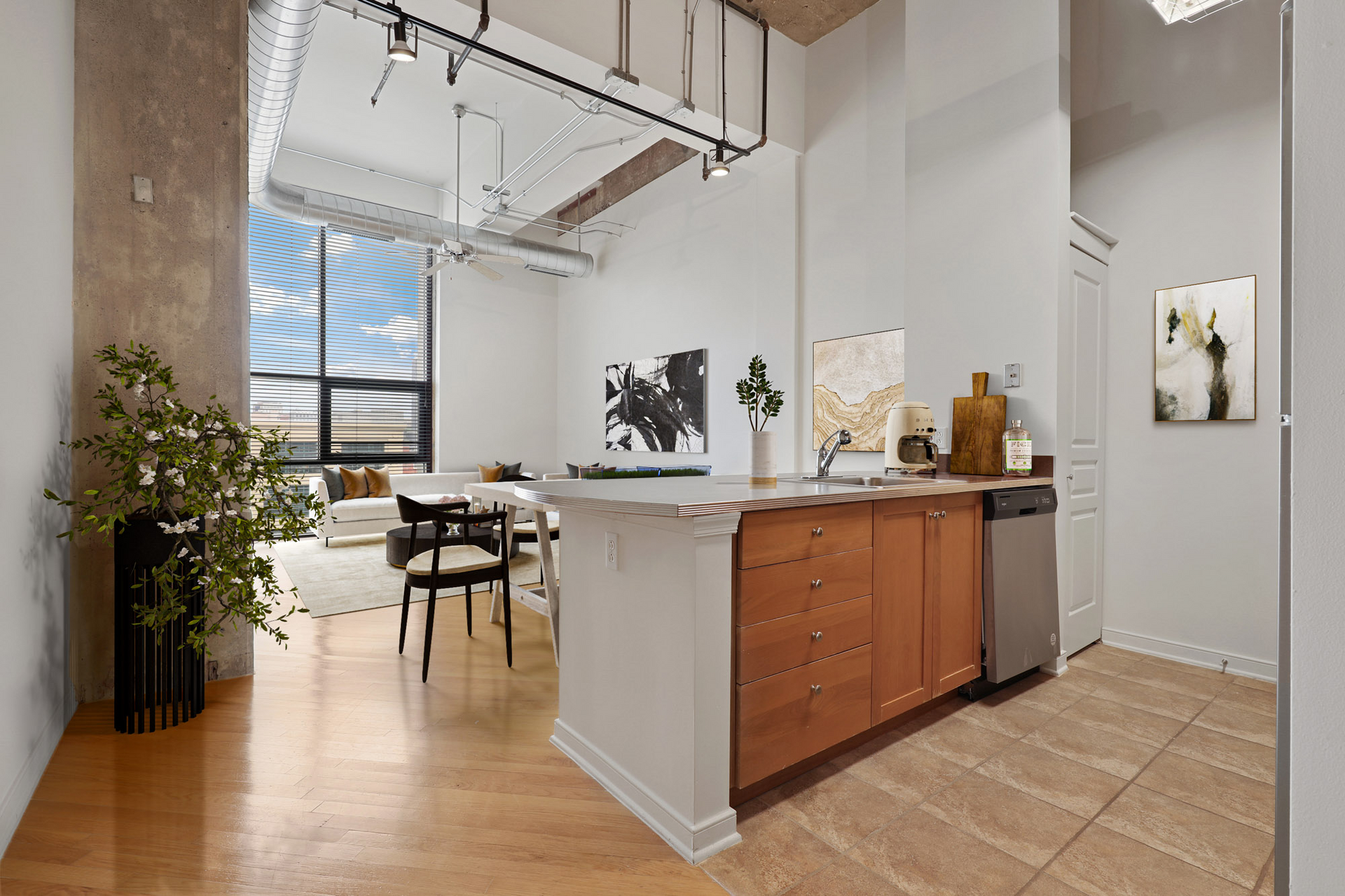 A kitchen with wooden cabinets and a stainless steel dishwasher.